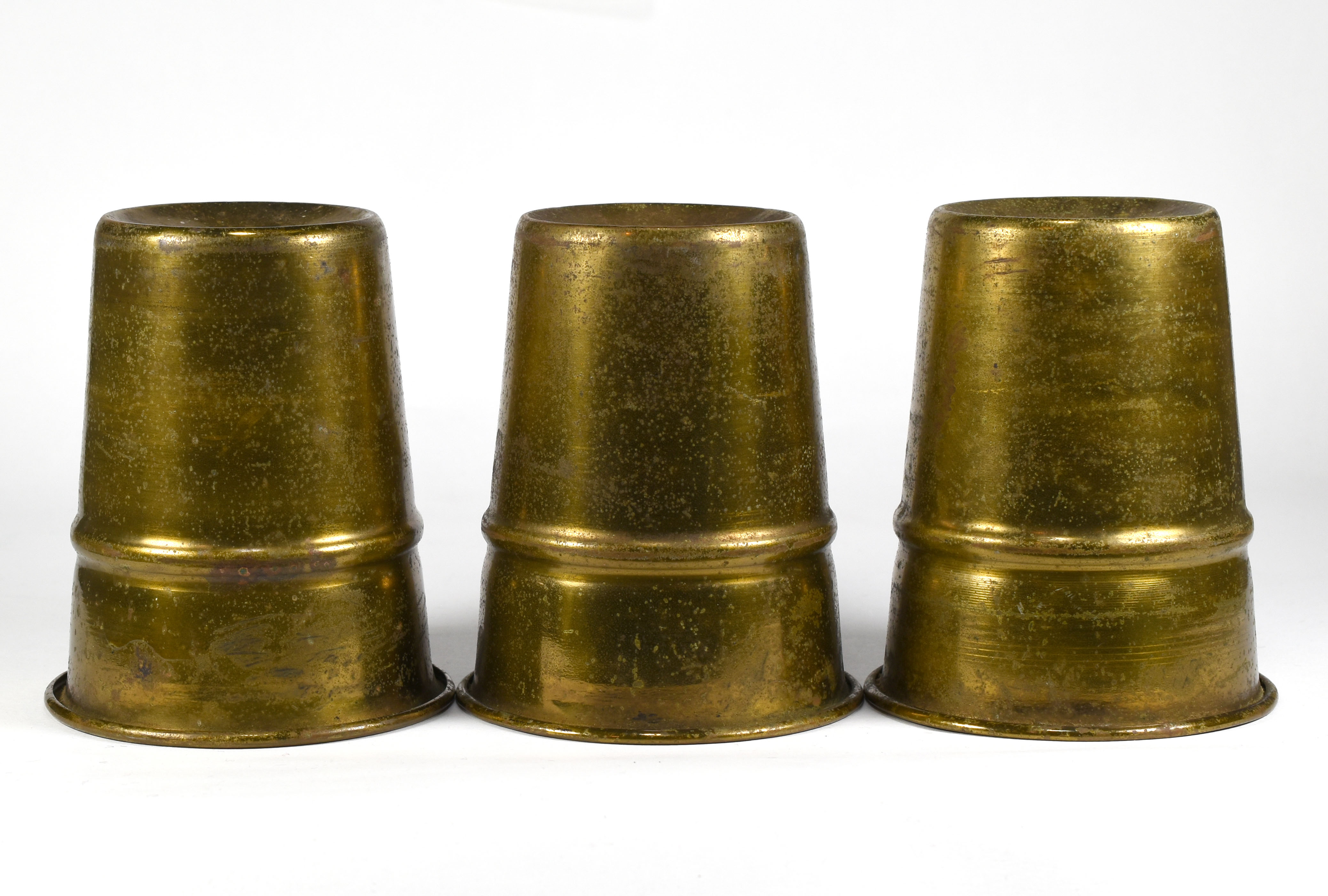 Antique Brass Cups Quicker than the Eye